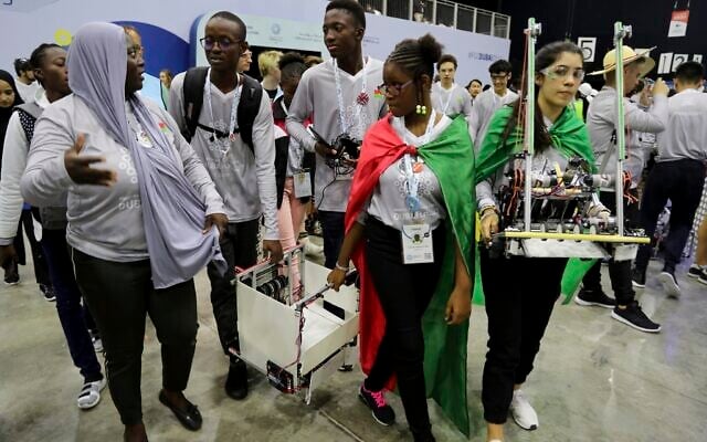 In this Friday, Oct. 25, 2019 photo, different team members carry their robots during the First Global Challenge, a robotics and artificial intelligence competition in Dubai, United Arab Emirates. (AP Photo/Kamran Jebreili) In this Friday, Oct. 25, 2019 photo, different team members carry their robots during the First Global Challenge, a robotics and artificial intelligence competition in Dubai, United Arab Emirates. (AP Photo/Kamran Jebreili)