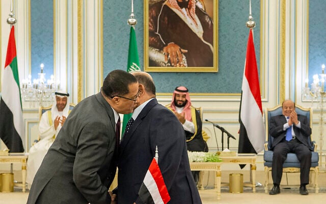 In this photo released by the Saudi Royal Palace, Yemeni Southern Transitional Council member and former Aden Governor Nasser al-Khabji, left, and Yemen’s deputy Prime Minister Salem al-Khanbashi greet each other before signing a power-sharing deal witnessed by Yemen's president, Abed Rabbo Mansour Hadi, background right, Saudi Arabia's Crown Prince Mohammed bin Salman, center, and Abu Dhabi's Crown Prince, Mohammed bin Zayed Al Nahyan, in Riyadh, Saudi Arabia, November 5, 2019. (Bandar Aljaloud/Saudi Royal Palace via AP) In this photo released by the Saudi Royal Palace, Yemeni Southern Transitional Council member and former Aden Governor Nasser al-Khabji, left, and Yemen’s deputy Prime Minister Salem al-Khanbashi greet each other before signing a power-sharing deal witnessed by Yemen's president, Abed Rabbo Mansour Hadi, background right, Saudi Arabia's Crown Prince Mohammed bin Salman, center, and Abu Dhabi's Crown Prince, Mohammed bin Zayed Al Nahyan, in Riyadh, Saudi Arabia, November 5, 2019. (Bandar Aljaloud/Saudi Royal Palace via AP)