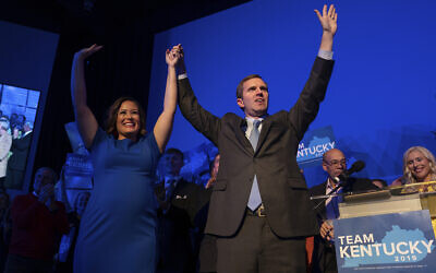 Democratic gubernatorial candidate and Kentucky Attorney General Andy Beshear, along with lieutenant governor candidate Jacqueline Coleman, acknowledge supporters at the Kentucky Democratic Party election night watch event, Nov. 5, 2019, in Louisville, Ky. (AP Photo/Bryan Woolston)