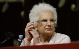 Holocaust survivor Liliana Segre speaks with young students on the occasion of an Holocaust remembrance, at the Arcimboldi theatre in Milan, Italy, January 24, 2018. (AP Photo/Luca Bruno)