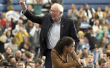 Democratic presidential candidate Sen. Bernie Sanders, Independent-Vermont,and Rep. Alexandria Ocasio-Cortez, Democrat-New York, wave to supporters following an election rally on the campus of Iowa Western Community College in Council Bluffs, Iowa, November. 8, 2019. (Nati Harnik/AP)