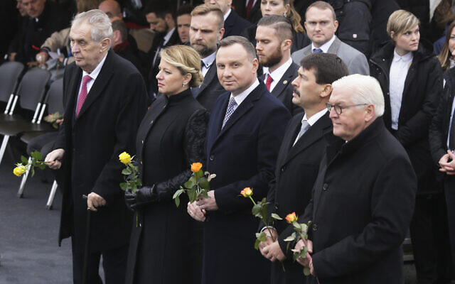 The Presidents of Germany Frank-Walter Steinmeier, Hungary Janos Ader, Poland Andrzej Duda, Slovakia Zuzana Caputova and of the Czech Republic Milos Zeman, from right, attend a commemoration ceremony to celebrate the 30th anniversary of the fall of the Berlin Wall at the Wall memorial site at Bernauer Strasse in Berlin, Nov. 9, 2019. (AP Photo/Markus Schreiber)