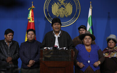 File photo: Bolivia's President Evo Morales, center, speaks during a press conference at the military base in El Alto, Bolivia, Nov. 10, 2019  (AP Photo/Juan Karita)