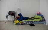 A child lies inside a bomb shelter in the coastal city of Ashkelon, Israel, amid a two-day bout of rocket fire from the Gaza Strip, November 13, 2019. (Tsafrir Abayov/AP)