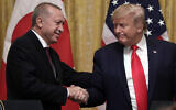 US President Donald Trump shakes hands with Turkish President Recep Tayyip Erdogan after a news conference in the East Room of the White House, Wednesday, Nov. 13, 2019, in Washington. (AP Photo/ Evan Vucci)