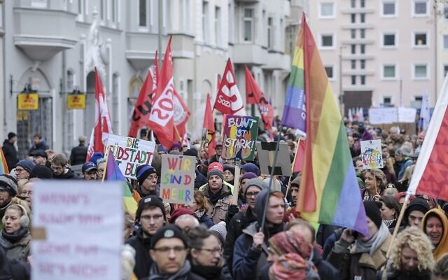 People take part in a protest rally against the German far-right party NPD in Hannover, Germany, Saturday, Nov. 23, 2019. (Ole Spata/dpa via AP) People take part in a protest rally against the German far-right party NPD in Hannover, Germany, Saturday, Nov. 23, 2019. (Ole Spata/dpa via AP)
