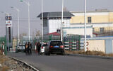 In this Dec. 3, 2018, file photo, a police station is seen by the front gate of the Artux City Vocational Skills Education Training Service Center in Artux in western China's Xinjiang region. Confidential documents, leaked to a consortium of news organizations, lay out the Chinese government's deliberate strategy to lock up ethnic minorities to rewire their thoughts and the language they speak.  (AP Photo/File)