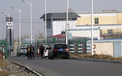In this Dec. 3, 2018, file photo, a police station is seen by the front gate of the Artux City Vocational Skills Education Training Service Center in Artux in western China's Xinjiang region. Confidential documents, leaked to a consortium of news organizations, lay out the Chinese government's deliberate strategy to lock up ethnic minorities to rewire their thoughts and the language they speak.  (AP Photo/File)