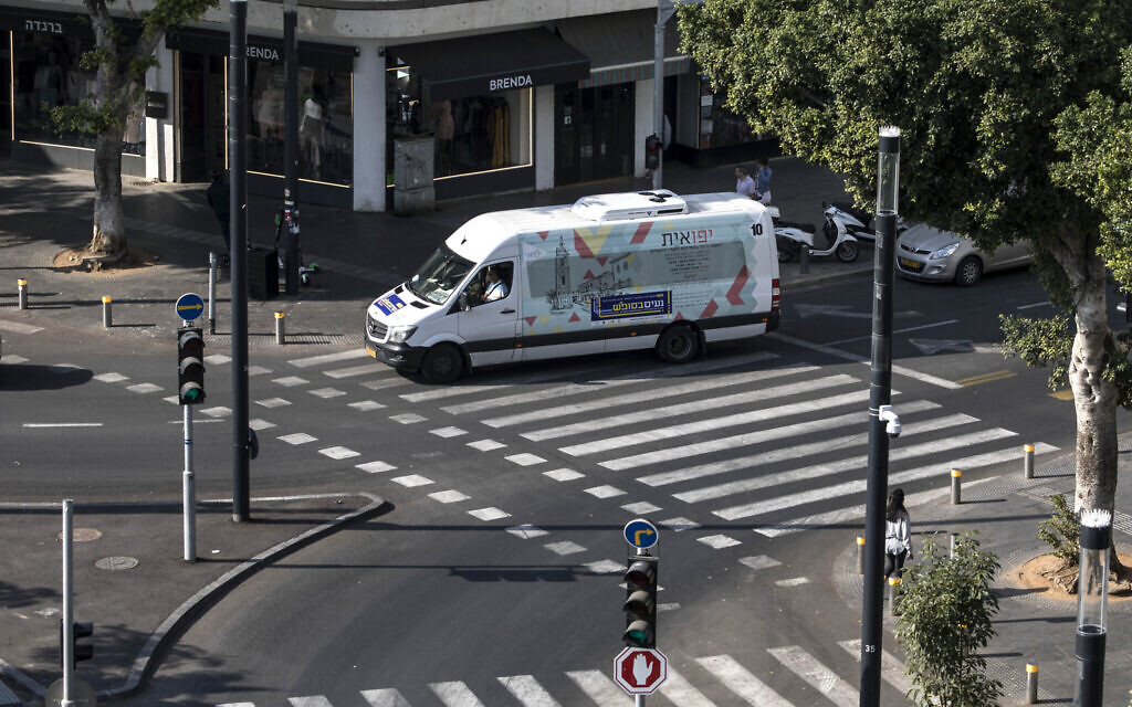 A public transport minibus drives through central Tel Aviv on Saturday, November 23, 2019. (Tsafrir Abayov/AP) A public transport minibus drives through central Tel Aviv on Saturday, November 23, 2019. (Tsafrir Abayov/AP)