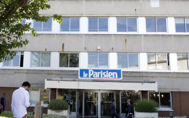 A man enters the headquarters of French newspaper Le Parisien in Saint-Ouen, outside Paris, France, June 4, 2015. (Jacques Brinon/AP) A man enters the headquarters of French newspaper Le Parisien in Saint-Ouen, outside Paris, France, June 4, 2015. (Jacques Brinon/AP)