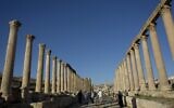 Illustrative: Tourists walk through the main street, the South Cardo, in the well preserved Ancient Roman city of Gerasa, in the city of Jerash, Jordan, November 13, 2015. (AP Photo/Nasser Nasser)