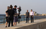 The TrueFeatures team filming in Caesarea National Park, with Joe Mullings, left, and Harel Gadot,  Executive Chairman and President of XACT Robotics Ltd.;  Nov. 5, 2019 (Paige Marogil)