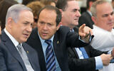 Nir Barkat (center) with Prime Minister Benjamin Netanyahu (left) during a special cabinet meeting for Jerusalem Day at the Ein Lavan spring in Jerusalem on June 2, 2016. (Marc Israel Sellem/Pool)