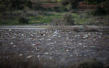 View of plastic bottles and other trash in the Beit Zait water reservoir near Jerusalem on March 1, 2019. (Hadas Parush/Flash90)