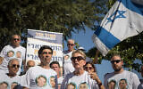 Bereaved parents of Hadar Goldin and other family members and supporters gather outside the state memorial ceremony for Operation Protective Edge at Mount Herzl on July 23, 2019. (Noam Revkin Fenton/Flash90)