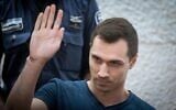 Aleksey Burkov, a Russian hacker slated for extradition to the United States, arrives for a hearing at the High Court of Justice in Jerusalem on November 3, 2019. (Yonatan Sindel/Flash90)