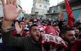 Mourners carry the body of 22-year-old Palestinian man Omar Haithm al-badawi who was shot dead by Israeli forces during clashes in al-arowb camp in the West Bank city of Hebron, on November 11, 2019. (Wisam Hashlamoun/Flash90)