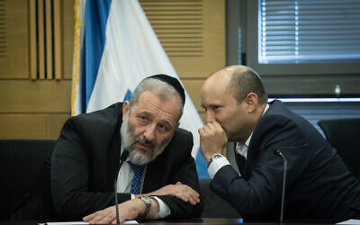 Defense Minister Naftali Bennett, right, speaks to Interior Affairs Minister Aryeh Deri during a meeting with right-wing bloc parties at the Knesset in Jerusalem on November 18, 2019. (Hadas Parush/Flash90)