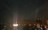 Screen capture from video of settlers protesting against security forces as they surround a home in the West Bank settlement of Yitzhar where a man violating an administrative order had barricaded himself inside, November 10, 2019. (Twitter)