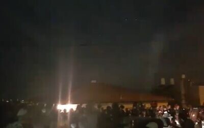 Screen capture from video of settlers protesting against security forces as they surround a home in the West Bank settlement of Yitzhar where a man violating an administrative order had barricaded himself inside, November 10, 2019. (Twitter)