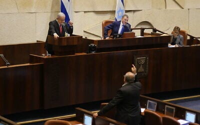 Joint List MK Ahmad Tibi (bottom) verbally clashing with Prime Minister Benjamin Netanyahu (L) during a Knesset plenum debate on Gaza, November 13, 2019. (Adina Wellman/Knesset spokesperson's office)