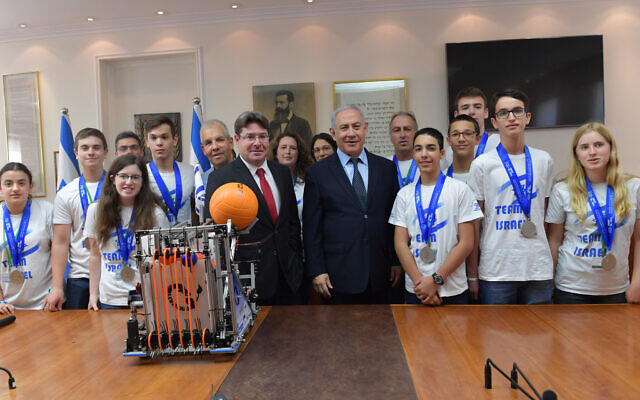 Illustrative: Prime Minister Benjamin Netanyahu (center right) and Science Minister Ofir Akunis greet the Israeli teen delegation upon their return from the unofficial 'Robotics Olympics' in Dubai. (Kobi Gideon/GPO) Illustrative: Prime Minister Benjamin Netanyahu (center right) and Science Minister Ofir Akunis greet the Israeli teen delegation upon their return from the unofficial 'Robotics Olympics' in Dubai. (Kobi Gideon/GPO)