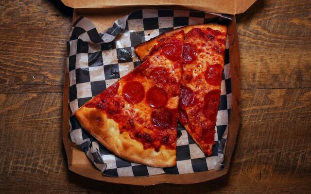 A British police officer is in hot water for allegedly dangling a slice of pepperoni pizza over a Jewish fellow officer's food. (Amanda Andrade-Rhoades/For The Washington Post via Getty Images via JTA)