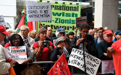 Illustrative: Anti-Israel activists react outside a meeting of the Labour National Executive Committee in London, September 4, 2018. (Stefan Rousseau/PA via AP)