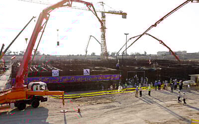 In this photo by the Atomic Energy Organization of Iran, concrete is poured for the base of the second nuclear power reactor at Bushehr plant, some 440 miles (700 kilometers) south of the capital Tehran, Iran, November 10, 2019. (Atomic Energy Organization of Iran via AP)