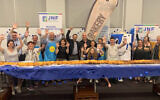 A kosher bakery in Sydney, Australia, breaks the Guinness world record for longest challah. (The Australian Jewish News/Facebook via JTA)