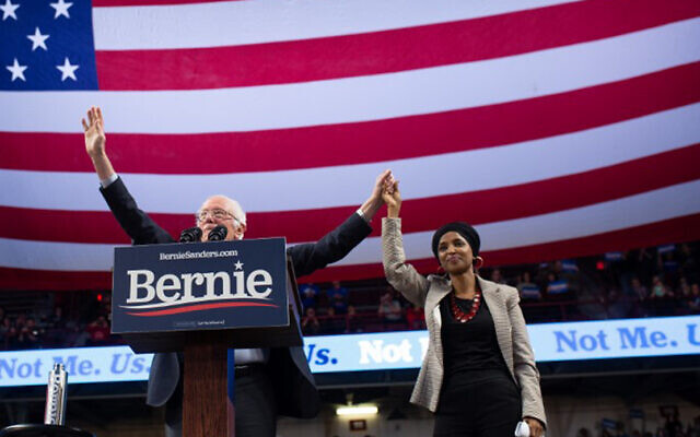 Democratic presidential hopeful Vermont Senator Bernie Sanders and Representative Ilhan Omar of Minnesota onstage at a campaign rally in Minneapolis, Minnesota, November 3, 2019. (Kerem Yucel/AFP) Democratic presidential hopeful Vermont Senator Bernie Sanders and Representative Ilhan Omar of Minnesota onstage at a campaign rally in Minneapolis, Minnesota, November 3, 2019. (Kerem Yucel/AFP)