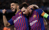 Barcelona's Lionel Messi, right, and Luis Suarez, left, celebrate after a Messi goal in Barcelona, Spain, March 13, 2019. (AP Photo/Emilio Morenatti)