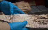 Items are removed from a time capsule from 1906 found in the cornerstone of the Tree of Life synagogue's former location in Pittsburgh, November 4, 2019. (Screenshot: YouTube)