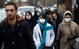 Iranian women wear masks for protection against air pollution in Tehran, Iran, December 20, 2015. (AP Photo/Vahid Salemi)