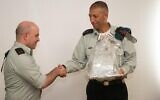 Maj. Gen. Lior Carmeli, right, shakes hands with the outgoing commander of the IDF's Digital Transformation Administration, Brig. Gen. Omer Dagan, at a ceremony at the military's Tel Aviv headquarters on November 7, 2019. (Israel Defense Forces)