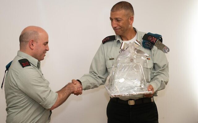 Maj. Gen. Lior Carmeli, right, shakes hands with the outgoing commander of the IDF's Digital Transformation Administration, Brig. Gen. Omer Dagan, at a ceremony at the military's Tel Aviv headquarters on November 7, 2019. (Israel Defense Forces) Maj. Gen. Lior Carmeli, right, shakes hands with the outgoing commander of the IDF's Digital Transformation Administration, Brig. Gen. Omer Dagan, at a ceremony at the military's Tel Aviv headquarters on November 7, 2019. (Israel Defense Forces)