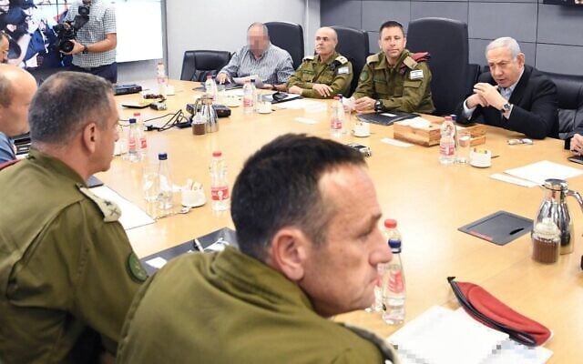 Prime Minister Benjamin Netanyahu, top right, in security consultations with other defense brass on November 13, 2019. (Amos Ben Gershon/GPO) Prime Minister Benjamin Netanyahu, top right, in security consultations with other defense brass on November 13, 2019. (Amos Ben Gershon/GPO)