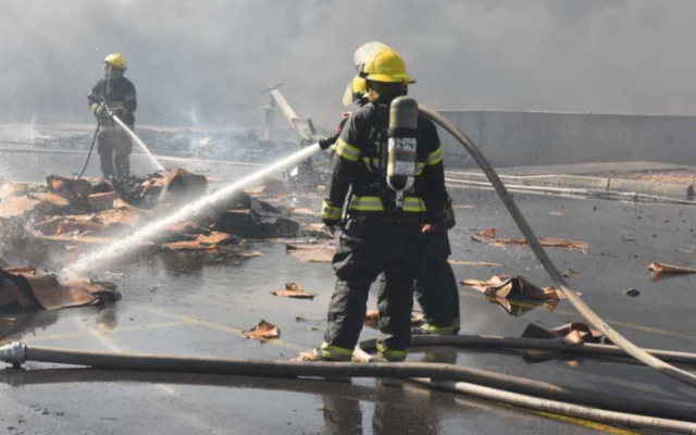 Firefighters battle a blaze at an industrial zone near the southern Bedouin city of Rahat on November 18, 2019. (Fire and Rescue Services) Firefighters battle a blaze at an industrial zone near the southern Bedouin city of Rahat on November 18, 2019. (Fire and Rescue Services)
