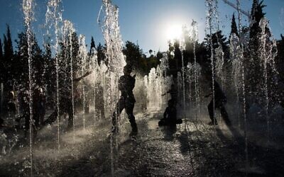 Children play in a water fountain on a hot summer's day near the Tower of David in  Jerusalem, July 30, 2013.  (Yonatan Sindel/Flash90)
