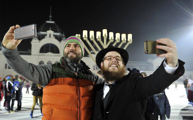Rabbi Slomo Koves, right, and a participant at Chabad Hungary's 2015 Hanukkah on Ice event at Budapest's City Park Ice Rink, December 6, 2015. (Courtesy of EMIH via JTA/ File) Rabbi Slomo Koves, right, and a participant at Chabad Hungary's 2015 Hanukkah on Ice event at Budapest's City Park Ice Rink, December 6, 2015. (Courtesy of EMIH via JTA/ File)