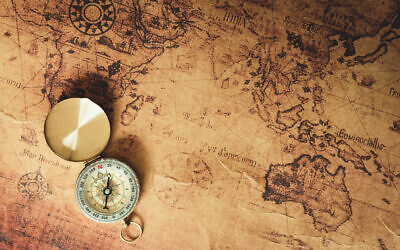 Illustrative picture of an old map and compass. (12963734/iStock by Getty Images)