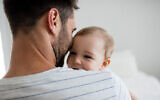 Illustrative: Father holding his baby girl at home. (Wavebreakmedia; iStock by Getty Images)