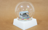 One of Shaul Cohen's iconic snow globes, designed with a humorous twist (Courtesy Shaul Cohen)