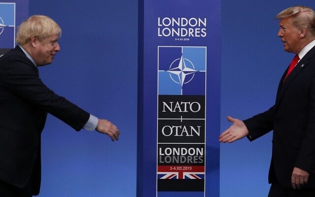 Britain's Prime Minister Boris Johnson (L) greets US President Donald Trump upon arrival for the NATO summit at the Grove hotel in Watford, northeast of London, on December 4, 2019. (Adrian DENNIS / AFP) Britain's Prime Minister Boris Johnson (L) greets US President Donald Trump upon arrival for the NATO summit at the Grove hotel in Watford, northeast of London, on December 4, 2019. (Adrian DENNIS / AFP)