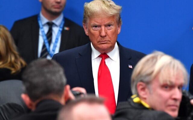 US President Donald Trump attends the plenary session of the NATO summit at the Grove hotel in Watford, northeast of London on December 4, 2019. (Nicholas Kamm/AFP) US President Donald Trump attends the plenary session of the NATO summit at the Grove hotel in Watford, northeast of London on December 4, 2019. (Nicholas Kamm/AFP)