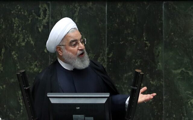 Iran's President Hassan Rouhani delivers a speech to present the budget for the financial year starting late March 2020 to the parliament in Tehran on December 8, 2019. (STR/AFP) Iran's President Hassan Rouhani delivers a speech to present the budget for the financial year starting late March 2020 to the parliament in Tehran on December 8, 2019. (STR/AFP)