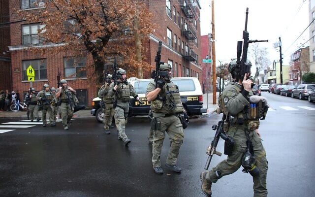 Police officers arrive at the scene of a shooting in Jersey City, New Jersey on December 10, 2019. (Kena Betancur/AFP) Police officers arrive at the scene of a shooting in Jersey City, New Jersey on December 10, 2019. (Kena Betancur/AFP)