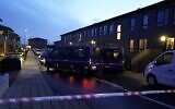 Police cars are parked in front of houses in Aalborg on December 11, 2019 during police action against suspected terrorists (Henning Bagger / Ritzau Scanpix / AFP)