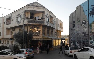 A picture taken on December 20, 2019, shows British artist Banksy's Walled-Off Hotel facing the security barrier in the West Bank town of Bethlehem. (Ahmad Gharabli/AFP) A picture taken on December 20, 2019, shows British artist Banksy's Walled-Off Hotel facing the security barrier in the West Bank town of Bethlehem. (Ahmad Gharabli/AFP)