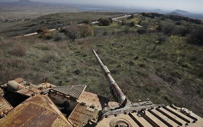 A picture taken from the remains of a tank dating back from the 1973 war shows the Syrian town of Quneitra, as seen from the  Golan Heights, on December 23, 2019. (JALAA MAREY / AFP)